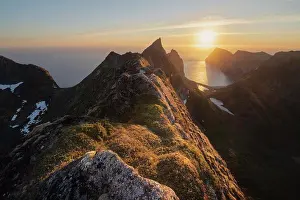 Scenics Prints: June midnight sun hangs low over sea above Kvalvika beach