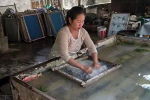 South East Asia Prints: The jute paper production (fibers are being spread in water in a sift) in Ban Xang Khong