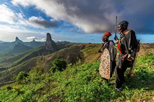 Hills Prints: Kapsiki tribal men in front of the lunar landscape of Rhumsiki peak