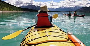 Small Group Of People Prints: Kayaker taking a break
