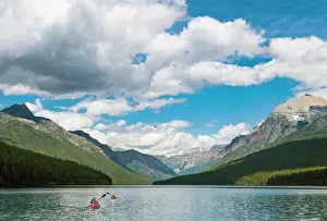 Montana Prints: Two Kayakers Kayaking On Bowman Lake In Glacier National Park