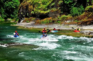 Protective Wear Prints: Kayakers near an eddy near Horseshoe Bend on the Cowichan River near Lake Cowichan, BC