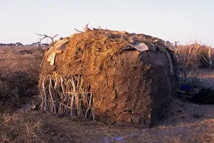 Kenya Prints: KENYA, AMBOSELI, MASAI VILLAGE, TRADITIONAL HUT WITH COW DUNG PLASTER