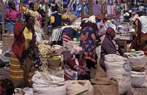 Kenyan Prints: Kenya, Loitokitok, Market Scene With Female Vendors Selling Grains And Food Products From Sacks
