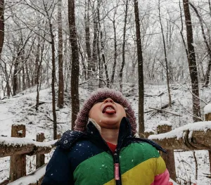 Winter Wonderland Prints: Kid catching snowflakes with tongue in the woods