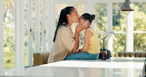 Prepare Prints: Kiss, mother and daughter with getting ready in home on kitchen table with backpack and greeting