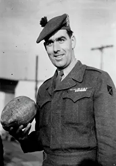 Soldier Prints: Korea V.C. Home -- Private Bill Speakman with the coconut he brought home from Korea for his kid brother Bert
