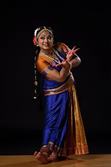 Gajra Prints: Kuchipudi dancer doing Alapadamam and Kataka mukha mudra while performing on stage