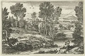 Landscape with woman walking along river