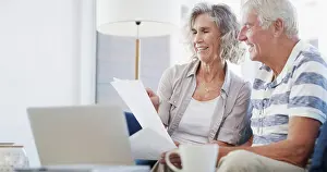 Bills Prints: Laptop, old couple and document on couch for budget