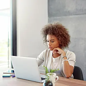 Social Network Prints: Laptop, research and reading with business woman in office for paid media specialist