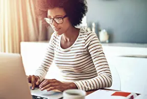 Browsing Prints: Laptop, typing and woman in office for research on demographic survey for blog project
