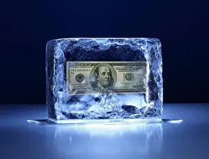 Spotlight Prints: Large block of ice with one hundred dollar bill frozen inside