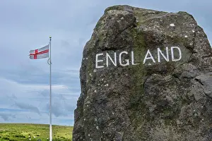 Carved Prints: A large stone and cross of St George mark the English Border with Scotland at Carter Bar