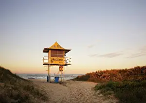 Waves Prints: Late afternoon shot of lifeguard tower on empty beach