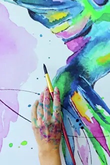 Paint Prints: Latin artist painting with watercolor in her studio