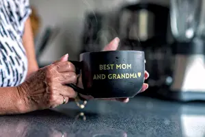 Grandma Prints: A latin grandma holding a black mug with a frase