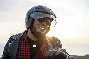 Cellphone Prints: Latin man motorcyclist look the desert at sunset