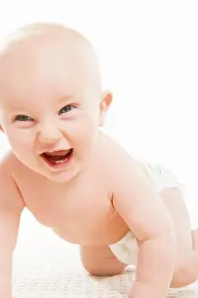 Verticals Prints: A laughing baby crawling