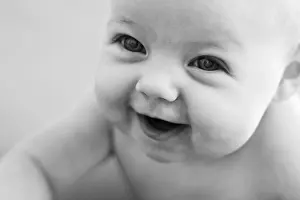 Innocent Prints: Laughing baby, studio shot