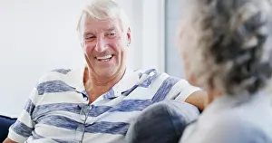 Elder Prints: Laughing, senior couple and bonding in home
