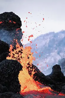 Glowing Prints: Lava Erupting From Spatter Cones within Pu'u O'o Vent