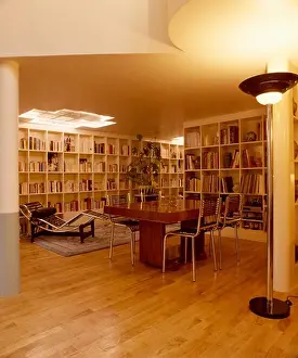 Dining Rooms Prints: Le Corbusier chaiselongue in twenties style dining room with parquet floors and shelving on walls