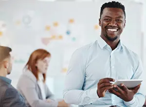 Black Man Prints: Leadership, motivation and business man planning on digital tablet and looking proud in a group meeting