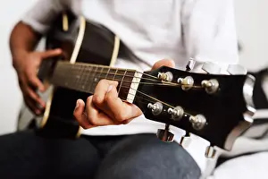 Anonymous Prints: Learning, guitar or hands of man in house for performance practice