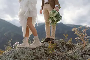Runner Prints: Legs of the bride and groom in wedding dresses