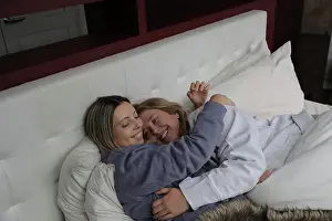 Pajamas Prints: Lesbian couple embracing in bed
