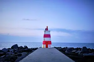 Faro Prints: A lighthouse off the coast of Portugal on an early January morning