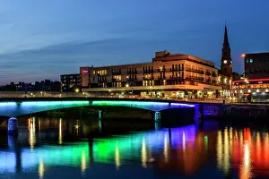 Multicoloured Prints: Lights under the Ness Bridge reflect in the River Ness in Inverness