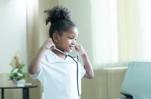 Mixed Prints: A little girl. with a big dream of growing up to be a doctor A little girl