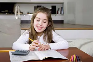 Mathematics Prints: A little girl doing her homework
