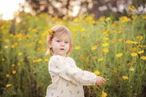 1 2 Years Old Prints: Little girl picking a yellow flower