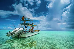 Model Release Prints: Little motorboat in the turquoise waters of the Ant Atoll, Pohnpei, Micronesia. (MR)