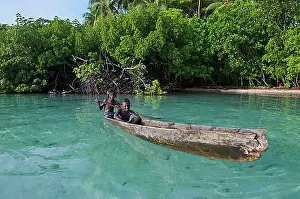 Looks Into The Camera Prints: Local boys in a canoe in the Marovo Lagoon