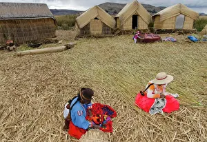 Inca Prints: Local residents of floating reed islands of Uros, Lake Titicaca, Peru
