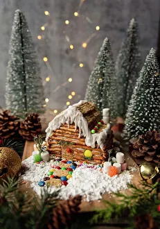 Decorations Prints: Log cabin style gingerbread house surrounded by winter decorations