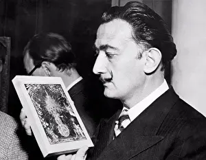 Oneperson Only Prints: London, England: December 3, 1951 Surrealiist artist Salvador Dali holds a minature sketch of a painting