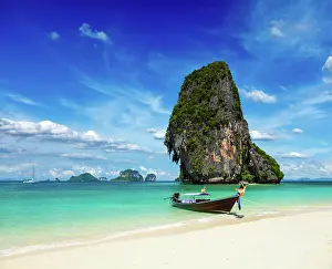 Limestone Prints: Long tail boat on tropical beach with limestone rock, Krabi, Thailand