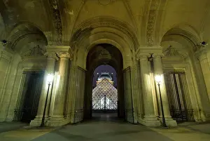 Elegance Prints: Looking down the Passage Richelieu of the Louvre Museum to the glass pyramid at night