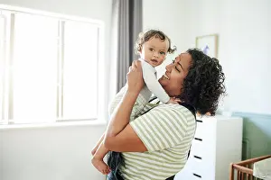 Connecting Prints: Love, happy and mother with her baby in his nursery bonding