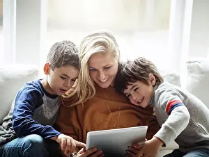 Family Home Prints: Love, tablet and mother with children on sofa bonding