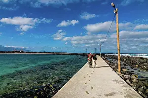 Partnership Prints: Lovers for a walk on path at coast. San Vincente. Cabo Verde. Africa