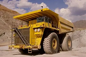 Gravel Prints: low angle dump truck earth mover yellow quarry mine