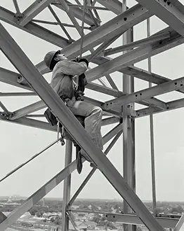 Full Length Prints: Low angle view of a construction worker in a harness, New Orleans, Louisiana, USA