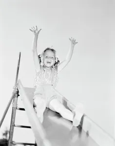 Slide Prints: Low angle view of girl on slide