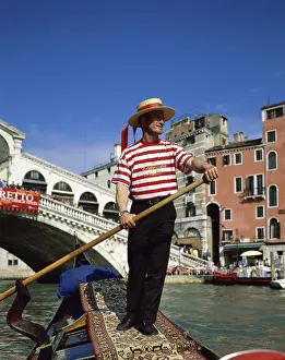 Arch Bridge Prints: Low angle view of a gondolier, Grand Canal, Venice, Italy